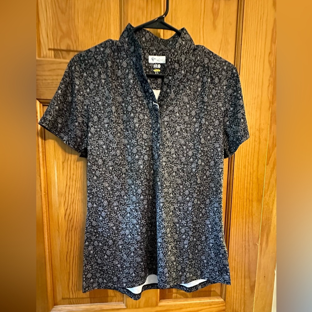 Woman’s Greg Norman golf shirt